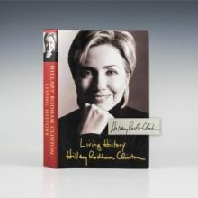 The book jacket of Living History featuring a portrait of Hillary Clinton and her signature
