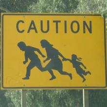 Thumbnail image of Immigrant Crossing Road Sign